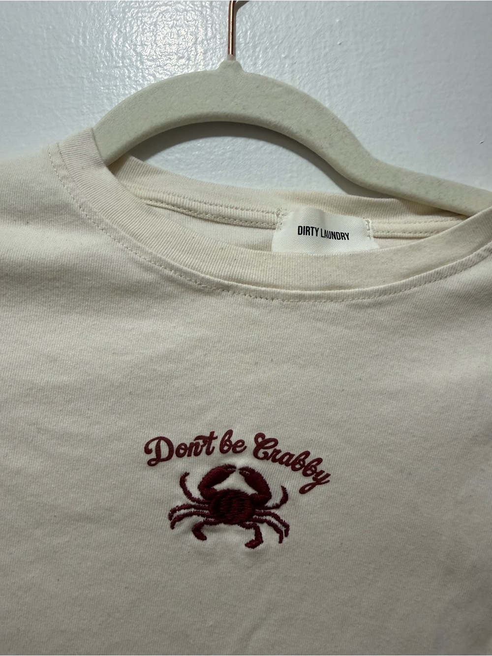 Dirty Laundry Cream Baby Tee with Maroon Crab Graphic
